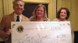 Mineola Lions make a $1000 donation to the Special Olympics.